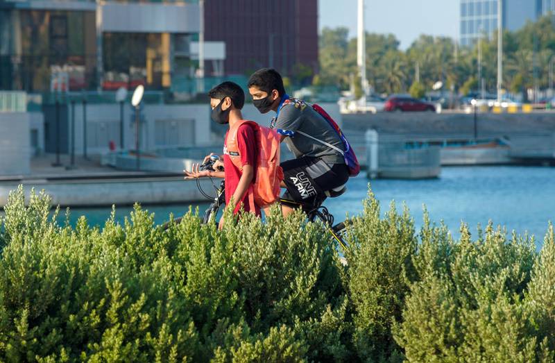 Abu Dhabi, United Arab Emirates, June 29, 2020.   Friends along the Ramada Hotel Abu Dhabi Corniche pathway as Covid-19 restrictions ease.Victor Besa  / The NationalSection:  NA / StandaloneReporter:  none