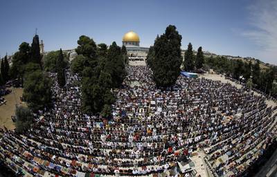 Worshippers pray outside the Dome of the Rock on the last Friday of Ramadan last year. AFP