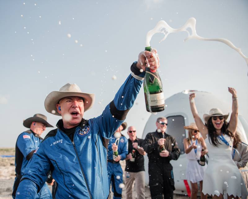 Blue Origin's founder Jeff Bezos celebrates his first successful landing in the desert outside of Van Horn, Texas. Photo: Blue Origin