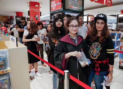 Hibah and Sarah Ali patiently waiting in line during the Harry Potter and the Cursed Child book launch at Virgin Megastore at Mall of the Emirates. Victor Besa for The National