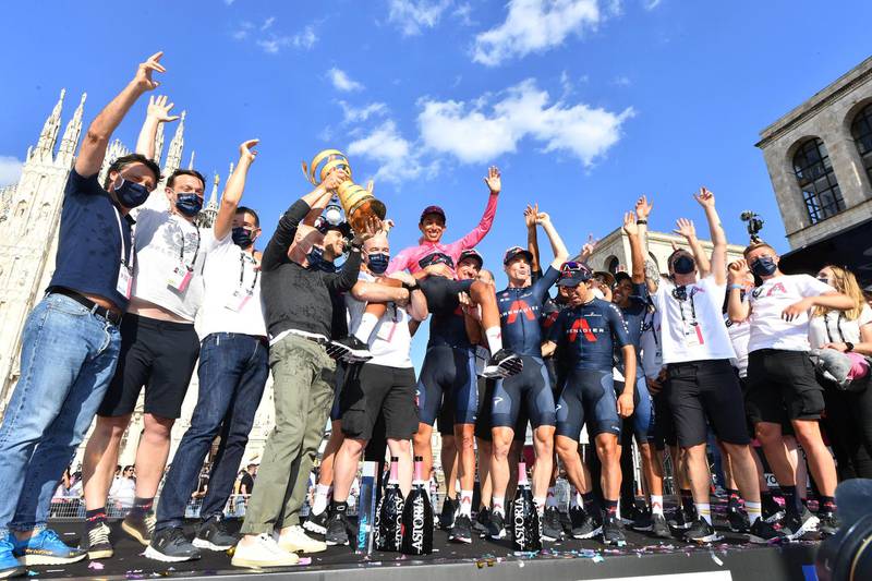 Ineos Grenadiers rider Egan Bernal poses with the trophy and teammates. Reuters