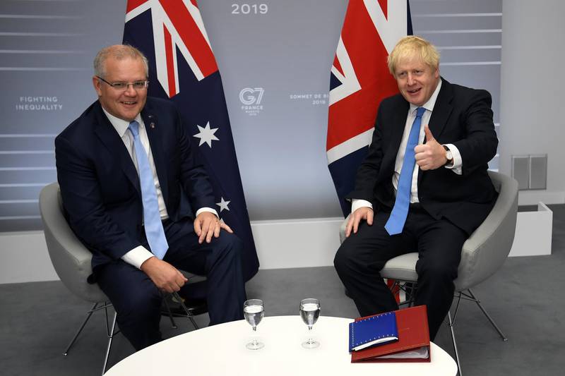 BIARRITZ, FRANCE - AUGUST 24: British Prime Minister Boris Johnson (R) meets Australian Prime Minister Scott Morrison (L) for their bilateral talks during the G7 Summit on August 24, 2019 in Biarritz, France. The French southwestern seaside resort of Biarritz is hosting the 45th G7 summit from August 24 to 26. High on the agenda will be the climate emergency, the US-China trade war, Britain's departure from the EU, and emergency talks on the Amazon wildfire crisis. (Photo by Neil Hall- Pool/Getty Images)