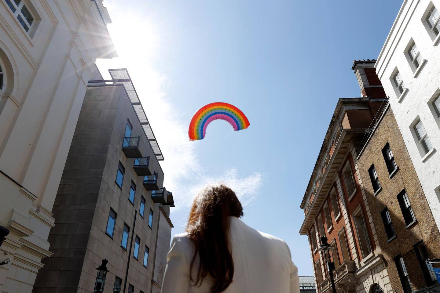 A rainbow arch balloon is flown above Covent Garden to celebrate the reopening of its shops, following the outbreak of the coronavirus disease (COVID-19) in London, Britain June 15, 2020. REUTERS/John Sibley