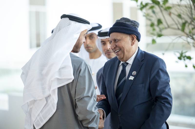 President Sheikh Mohamed lauded the 'rich legacy of creativity' left behind by poet Karim Al Iraqi, right. Photo: UAE Presidential Court