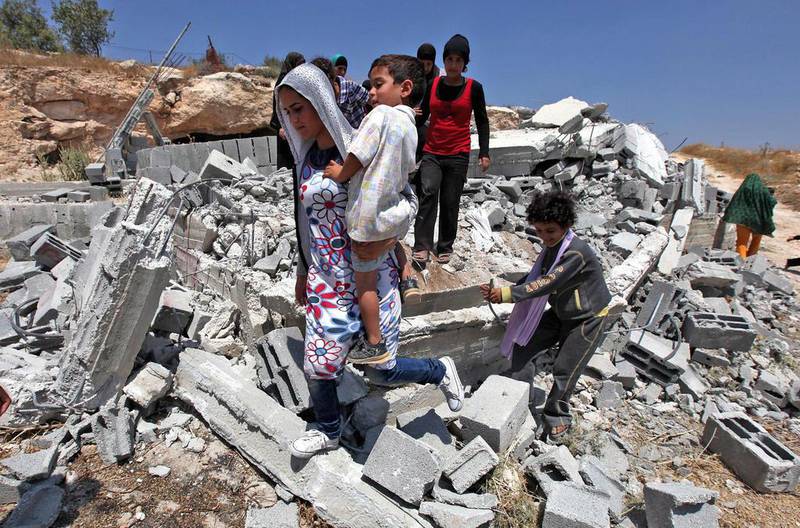 Palestinian houses demolished by Israeli soldiers in in 2010.  Abed Al Hashlamoun / EPA 