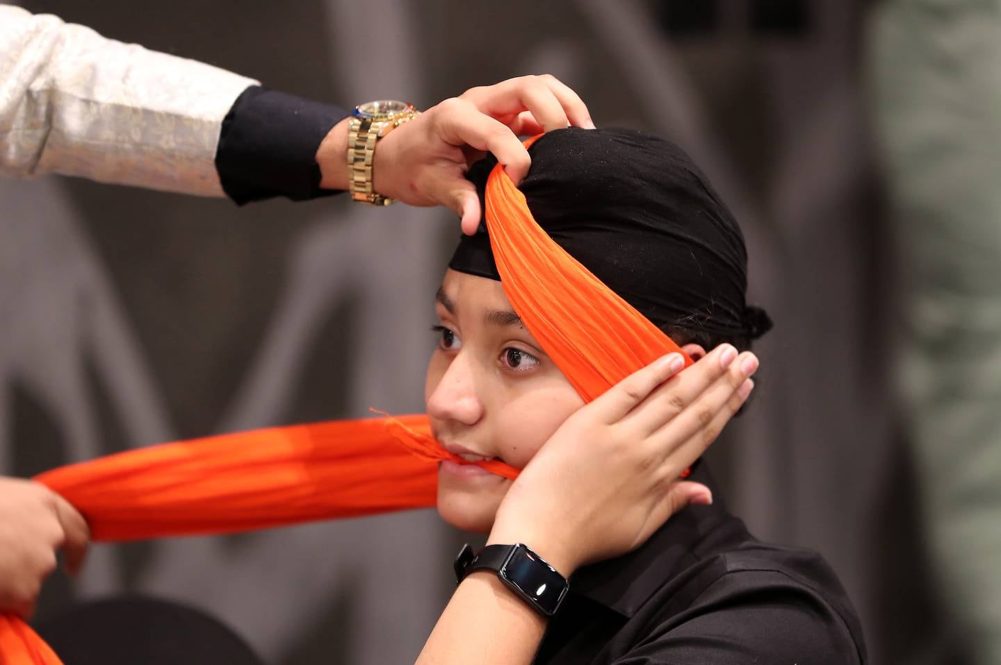 Young member gets his turban ready for the event. Pawan Singh / The National