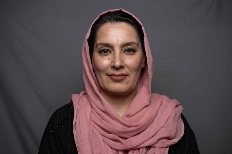 Shaima Wafa, 40, a cultural affairs reporter for an Iranian media outlet, poses for a portrait in Herat.