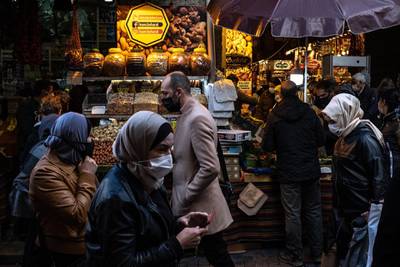 ISTANBUL, TURKEY - APRIL 09: People wearing protective face masks shop ahead of the start of the holy month of Ramadan on a busy market street on April 09, 2021 in Istanbul, Turkey. Turkey announced more than 55,000 new Covid-19 cases in the past 24hrs,  a new daily record since the start of the pandemic. Turkey recently lifted restrictions allowing restaurants and cafes to reopen for indoor and outdoor dining during limited hours. Fears are growing that coronavirus cases will continue to rise as the country prepares to celebrate the holy month of Ramadan starting on April 13.  (Photo by Chris McGrath/Getty Images)