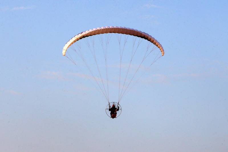A Saudi youth flies a powered parachute in al-Thumama park in Riyadh, Saudi Arabia. Reuters