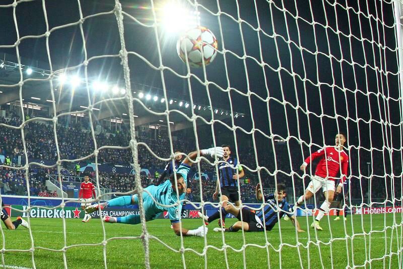 Manchester United's Cristiano Ronaldo scores during the Champions League match against Atalanta at the Gewiss Stadium in November, 2021. EPA 