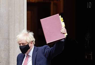 Britain's Prime Minister Boris Johnson, wearing a face covering due to the COVID-19 pandemic, leaves 10 Downing Street in central London on October 7, 2020, to attend the weekly session of Prime Minister's Questions (PMQs) at the House Commons. Britain has suffered the worst death toll in Europe from the novel coronavirus COVID-19 outbreak, with more than 42,000 confirmed deaths. / AFP / Niklas HALLE'N
