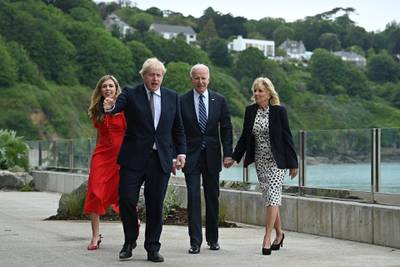 Britain's Prime Minister Boris Johnson (2L) and Britain's First Lady Carrie Johnson (L) walk with US President Joe Biden and US First Lady Jill Biden prior to a bi-lateral meeting at Carbis Bay, Cornwall on June 10, 2021, ahead of the three-day G7 summit being held from 11-13 June.  G7 leaders from Canada, France, Germany, Italy, Japan, the UK and the United States meet this weekend for the first time in nearly two years, for the three-day talks in Carbis Bay, Cornwall. - 
 / AFP / Brendan SMIALOWSKI
