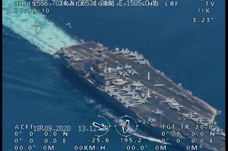 epa08690749 A handout picture released by the official website of Iranian Revolutionary Guard (IRGC) on 23 September 2020, reportedly shows the USS Nimitz Aircraft carrier prior to entering the Strait of Hormuz and Persian Gulf, which was taken by an Iranian IRGC drone. Media reported that Iranian IRGC has managed to fly a surveillance drone over the USS Nimitz aircraft carrier which last week transited from the Strait of Hormuz.  EPA/HANDOUT  HANDOUT EDITORIAL USE ONLY/NO SALES