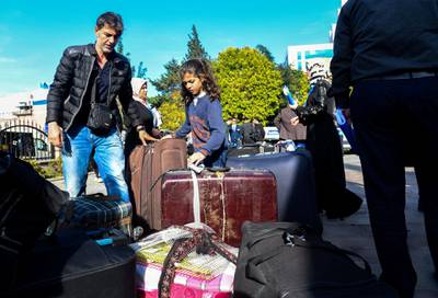  A one hundred and forty three Syrian refugees volunteered to return their homelands Jarablus,Damascus,Aleppo,A'zaz,Al Bab,Afrin load their belongings to trunks of the buses and wait for departure from Istanbul in Esenyurt Municipality garden.          EMRAH GUREL