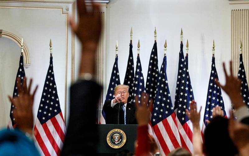 epa07049751 US President Donald J. Trump (C) talks with reporters during a press conference at the New York Lotte hotel in New York, New York, USA, 26 September 2018. The press conference is on the sidelines of General Debate of the United Nations General Assembly.  EPA/JUSTIN LANE