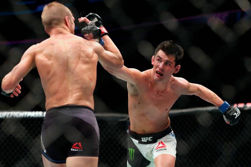 FILE - In this Jan. 17, 2016, file photo, Dominick Cruz throws a right against TJ Dillashaw in their mixed martial arts title bout at UFC Fight Night 81 n Boston. Cruz is scheduled to fight against Henry Cejudo at UFC249 in Jacksonville, Fla., on Saturday, May 9, 2020. (AP Photo/Gregory Payan, File)