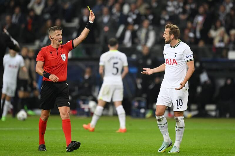 Harry Kane of Tottenham Hotspur reacts after being shown a yellow card by referee Daniele Orsato. Getty