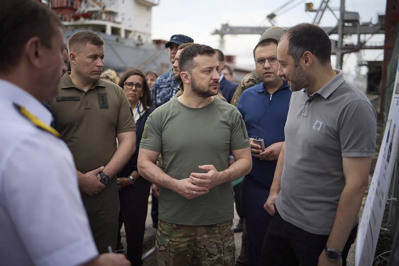 Ukrainian President Volodymyr Zelenskyy visits a port in Chornomork as grain is loaded on to a Turkish ship. AP