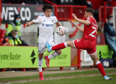 Crawley Town's Nicholas Tsaroulla in action with Leeds United's Ian Poveda during their FA Cup third-round tie. Reuters