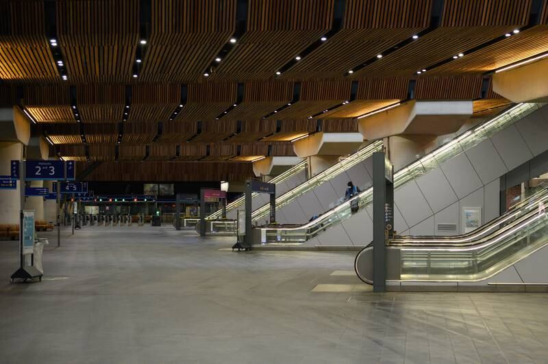 A lone worker cleans an escalator in a deserted London Bridge rail station. Getty Images