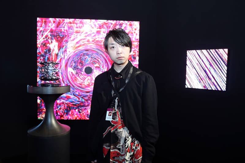 Yoichi Ochiai with his artwork at Art Dubai 