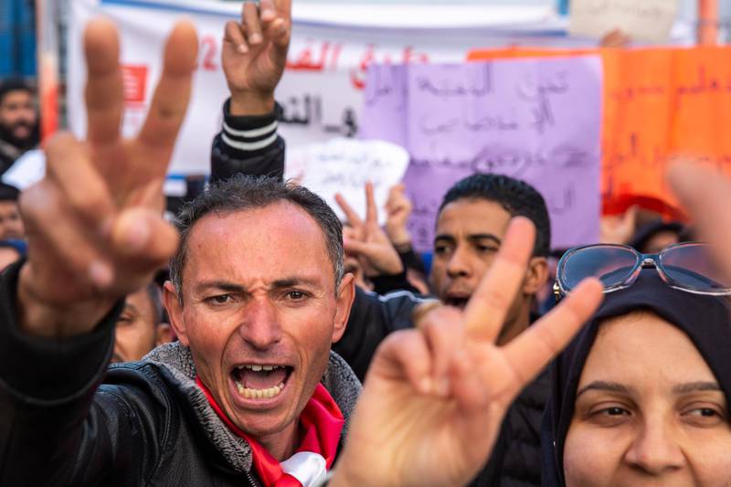 Tunisians show their anger against their purchasing power during a demonstration to mark the ninth anniversary of the democratic uprising in Tunis. AP