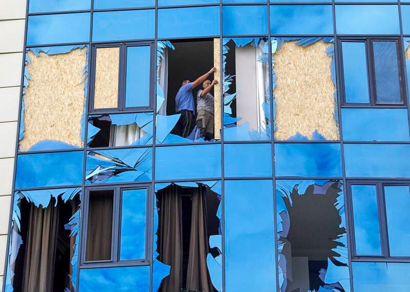 Fixing windows in the damaged Misto complex. EPA