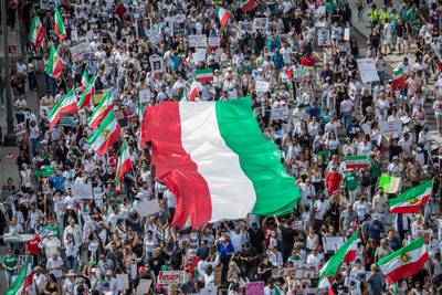 Demonstrators in Los Angeles, California, hold the Iranian flag during a protest against the government in Tehran. AFP