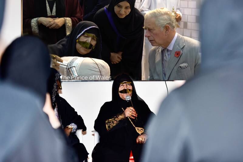 Emirati craftswoman Umm Ahmed at a Nama Women Advancement session at the annual International Government Communication Forum in Sharjah. A screen shows Britain's then Prince Charles watching craftswomen at work. Photo: Irthi Contemporary Crafts Council