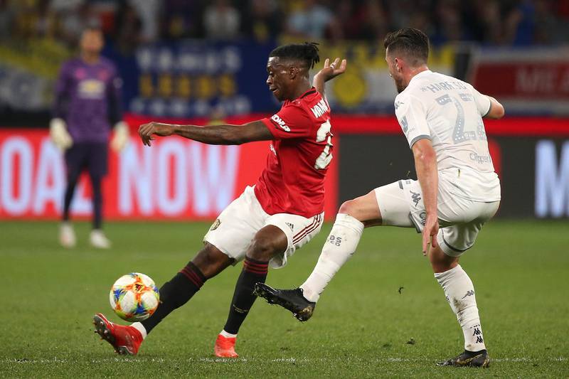 PERTH, AUSTRALIA - JULY 17: Aaron Wan-Bissaka of Manchester United controls the ball against Jack Harrison of Leeds during a pre-season friendly match between Manchester United and Leeds United at Optus Stadium on July 17, 2019 in Perth, Australia. (Photo by Paul Kane/Getty Images)