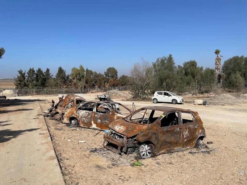 Cars damaged during the attack on Kfar Aza on October 7. Photo: The National