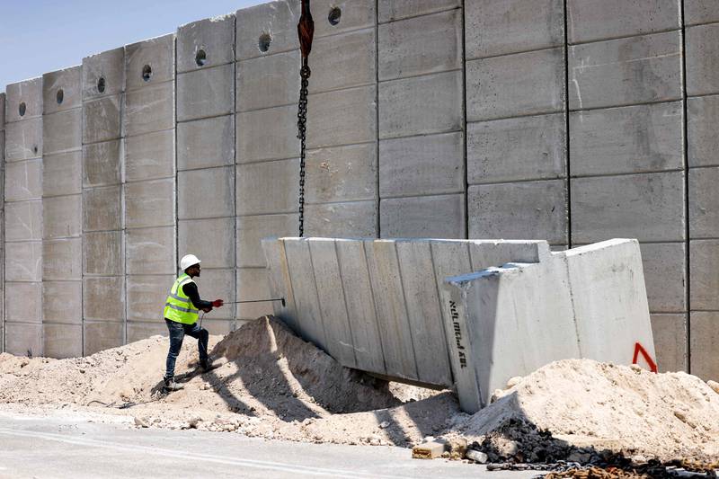 Israel is reinforcing an existing barrier in an attempt to stop Palestinians from crossing into its territory illegally.