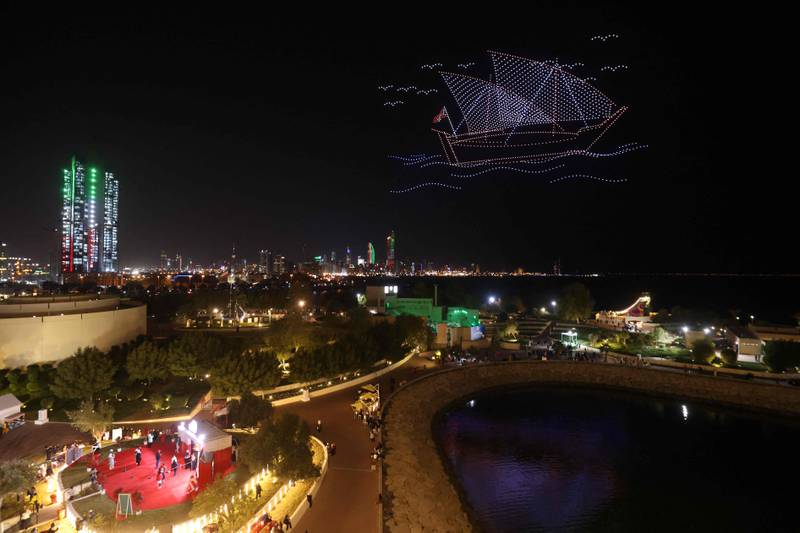 An image of a sailboat made of drones hovers above Green Island. Throughout February Kuwait celebrates its 62nd Independence Day