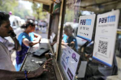 Signage for digital-payments provider Paytm, operated by One97 Communications Ltd., is displayed at a telephone booth in the Parel area of Mumbai, India, on Saturday, Jan. 28, 2017. India's Finance Ministry will recommend bold tax reform to ensure that Prime Minister Narendra Modi's growth-crimping cash ban wasn't in vain, people familiar with the matter said. Photographer: Dhiraj Singh/Bloomberg