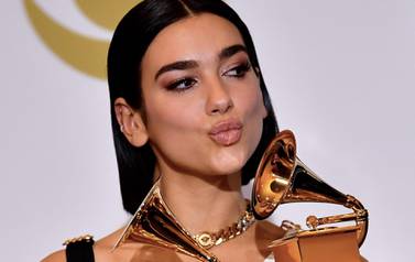 Singer Dua Lipa poses with her awards for Best New Artist and Best Dance Recording "Electricity" in the press room during the 61st Annual Grammy Awards on February 10, 2019, in Los Angeles. / AFP / FREDERIC J. BROWN