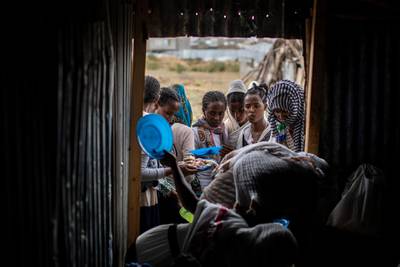Tigrayans stand in line to receive food donated by local residents at a reception center for the internally displaced in Mekele, in the Tigray region of northern Ethiopia. AP Photo