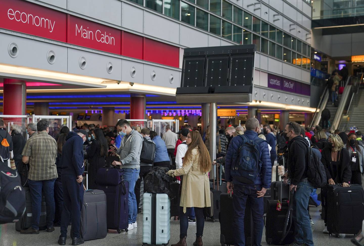 Passengers at Heathrow Airport in London. Airport fees are charged to airlines but are generally passed down to passengers in fare prices. PA
