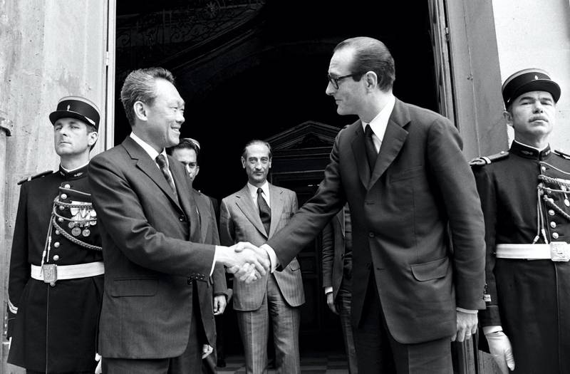 In a picture taken on July 2, 1974 Singapore Prime Minister  Lee Kuan Yew (L) shakes hands with French Prime Minister Jacques Chirac at Matignon in Paris. Lee served as prime minister from 1959, when Singapore gained self-rule from colonial ruler Britain, until he stepped down in 1990 in favour of his deputy Goh Chok Tong, who in turn handed power to Lee Hsien Loong in 2004. AFP PHOTO (Photo by STF / AFP)