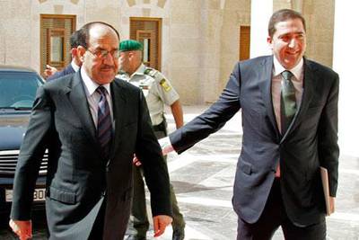 The Jordanian prime minister Samir Rifai, right, welcomes the Iraqi prime minister Nouri al Maliki yesterday.