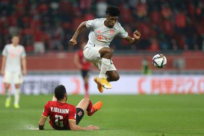 Bayern's Kingsley Coman skips over a challeng by Yasser Ibrahim of Al Ahly. AP