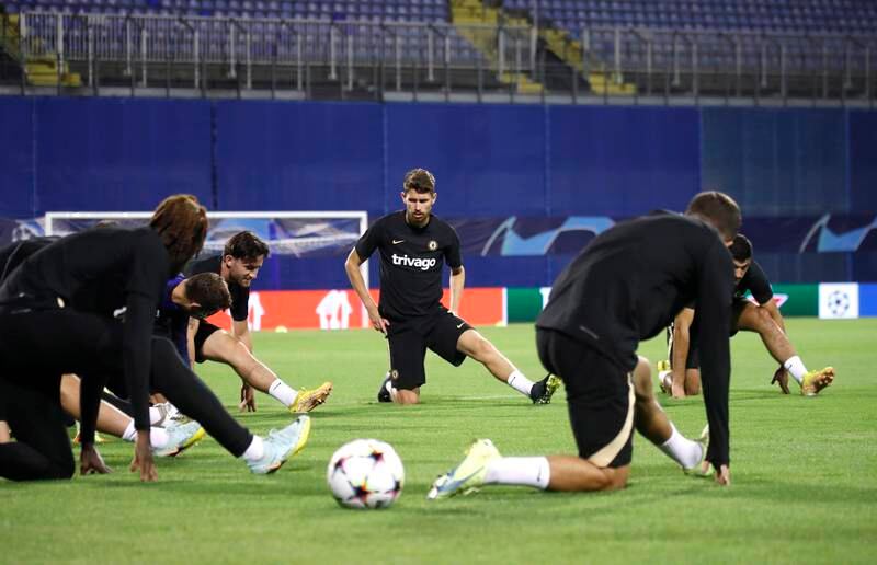 Chelsea midfielder Jorginho, centre, stretches alongside teammates. EPA