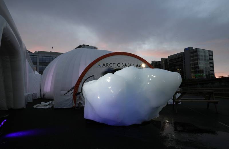 The melting remains of an iceberg delivered by members of Arctic Basecamp science campaign group to Glasgow.  The four-tonne block of ice – originally part of a larger glacier – was brought from Greenland to highlight the climate crisis. AP Photo