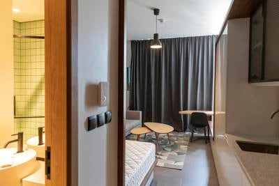 Inside a studio apartment at Hive, a new co-living apartment block in JVC, Dubai. Tenants do not have to pay a penalty if they leave a rental agreement early. Photo by Antonie Robertson / The National