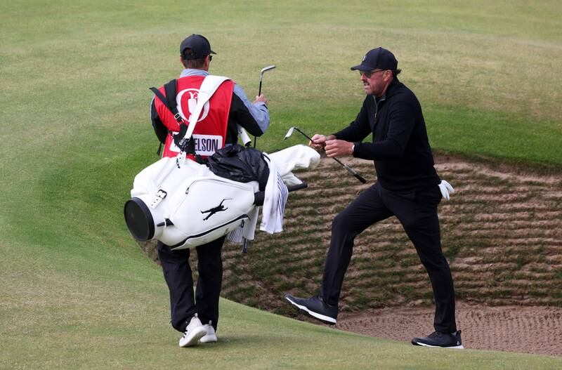  Phil Mickelson of the US climbs out of a bunker on the 17th hole. Getty 