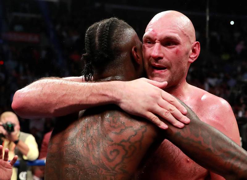Deontay Wilder and Tyson Fury react after the fight. Reuters