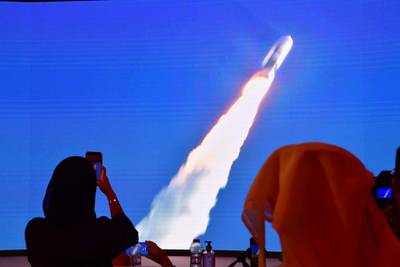 (FILES) This file photo taken on July 20, 2020, shows a screen broadcasting the launch of the "Hope" Mars probe at the Mohammed Bin Rashid Space Centre in Dubai. The first Arab interplanetary mission is expected to reach Mars' orbit on February 9, 2021, in what is considered the most critical part of the journey to unravel the secrets of weather on the Red Planet. The unmanned probe -- named "Al-Amal" -- Arabic for "Hope" -- blasted off from Japan last year, marking the next step in the United Arab Emirates' ambitious space programme. / AFP / Giuseppe CACACE
