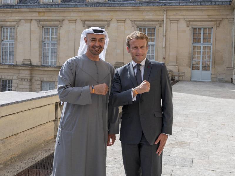 Sheikh Mohamed and French President Emmanuel Macron, wearing Expo 2020 Dubai wristbands, at the Fontainebleau Palace, France, in September 2021. Photo: Ministry Of Presidential Affairs