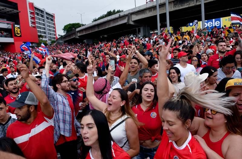 Costa Rican fans celebrate in the streets of San Jose after the national team qualified for World Cup 2022 following a nervy 1-0 win over New Zealand in their intercontinental play-off in Qatar on Tuesday, June 14, 2022. AFP