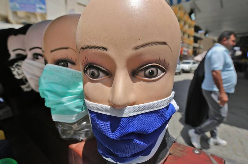 Mannequin heads wearing protective masks are pictured in central Baghdad. AFP