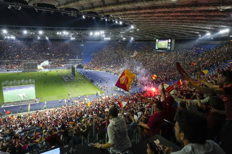 Roma supporters celebrate inside the Olympic Stadium in Rome after the team's victory in the Europa Conference League final against Feyenoord in Tirana. AP